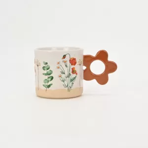 floral handle ceramic mug, nature-inspired coffee mug, botanical print ceramic cup, rustic clay texture mug, plant-themed tea mug, aesthetic nature mug