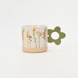 floral handle ceramic mug, nature-inspired coffee mug, botanical print ceramic cup, rustic clay texture mug, plant-themed tea mug, aesthetic nature mug
