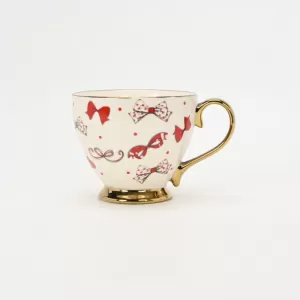 bow mug, polka dot ceramic mug, gold-plated handle mug, elegant coffee cup, cute bow design mug, luxury ceramic mug, stylish mug with gold handle, refined coffee cup, decorative ceramic mug, gift mug 