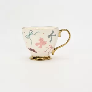 bow mug, polka dot ceramic mug, gold-plated handle mug, elegant coffee cup, cute bow design mug, luxury ceramic mug, stylish mug with gold handle, refined coffee cup, decorative ceramic mug, gift mug 