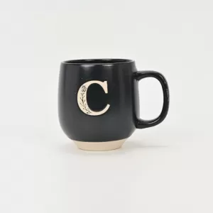 floral handle ceramic mug, nature-inspired coffee mug, botanical print ceramic cup, rustic clay texture mug, plant-themed tea mug, aesthetic nature mug