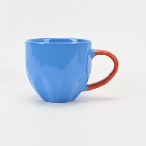 red blue ceramic mug, contrast color mug, petal relief coffee cup, floral-inspired ceramic cup, blooming flower tea mug, embossed petal design mug, artistic ceramic drinkware